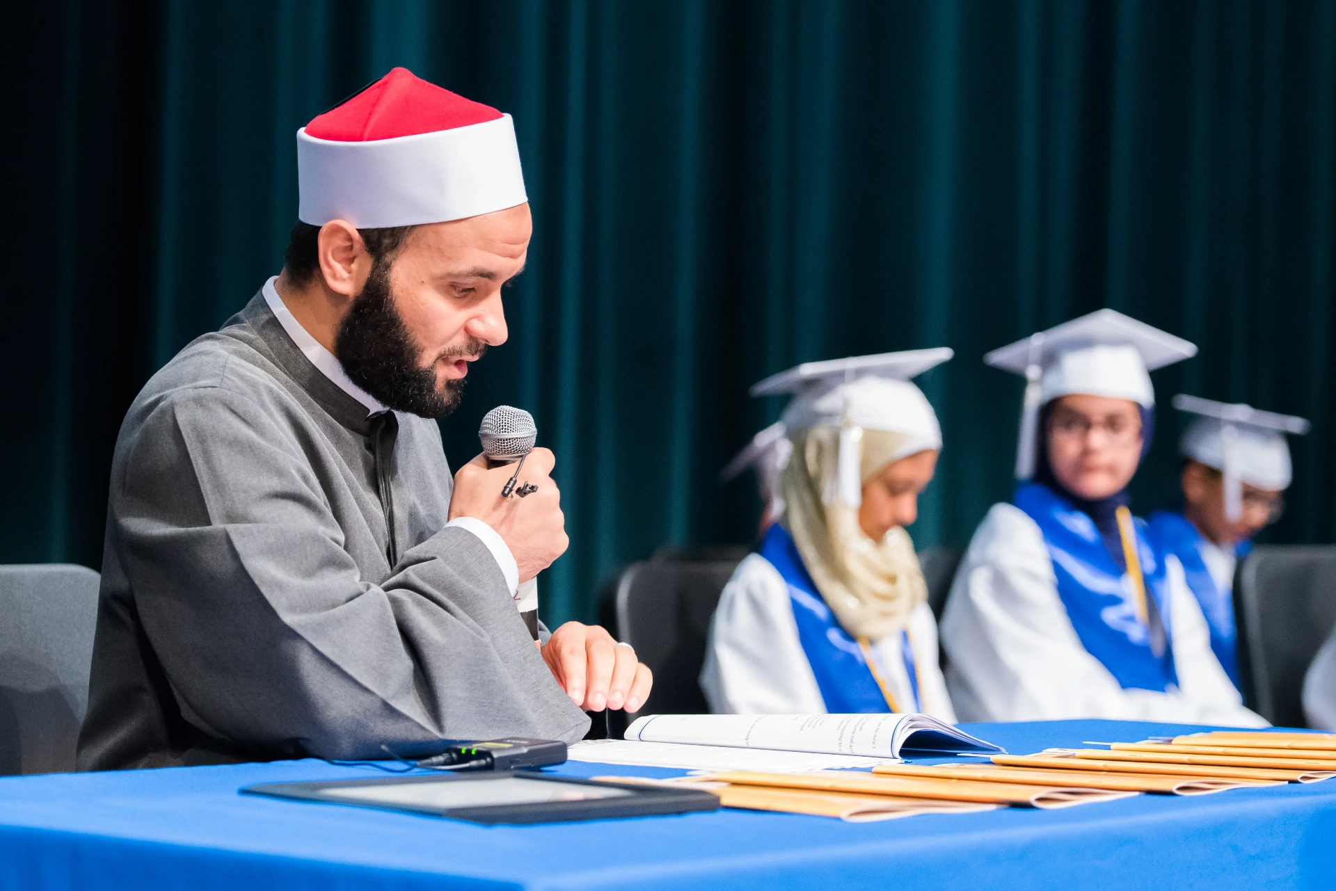 Ustaz Quran reading the mushaf